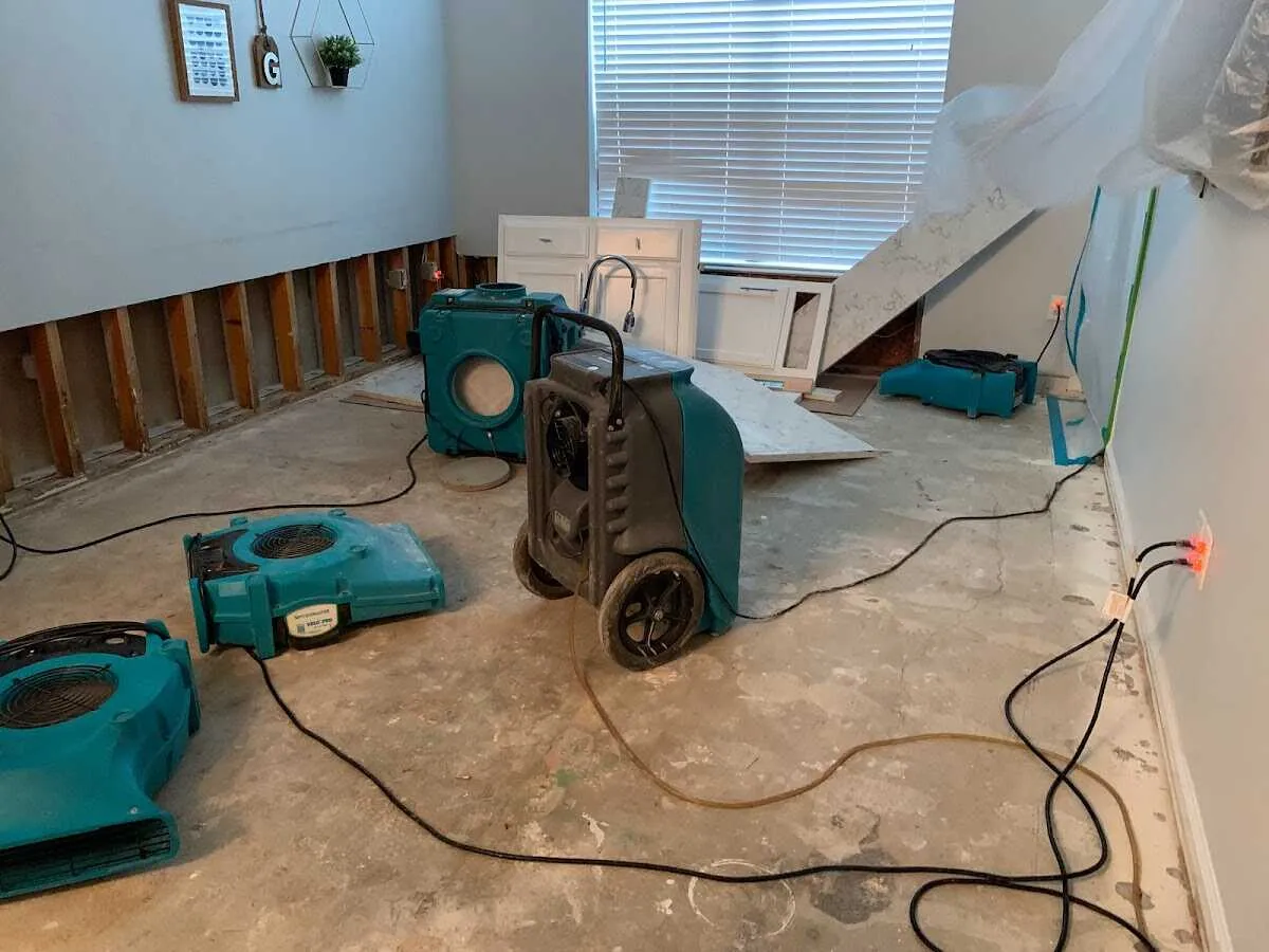 Dehumidifier in flood-cut room for Water Damage Restoration in Clayton